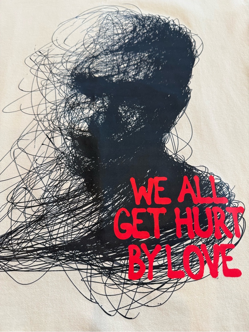 Men’s XS Oversized Graphic Tee “We All Get Hurt By Love” Unisex Tan